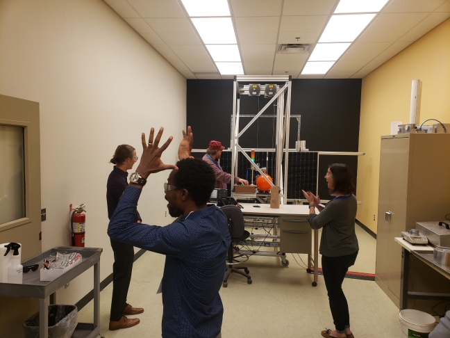 Reactions after a demonstration of a module hail test using CFV Lab's hail gun. It is loud! Later, we shot an 80 mm ice ball at a PV module; it broke the glass!