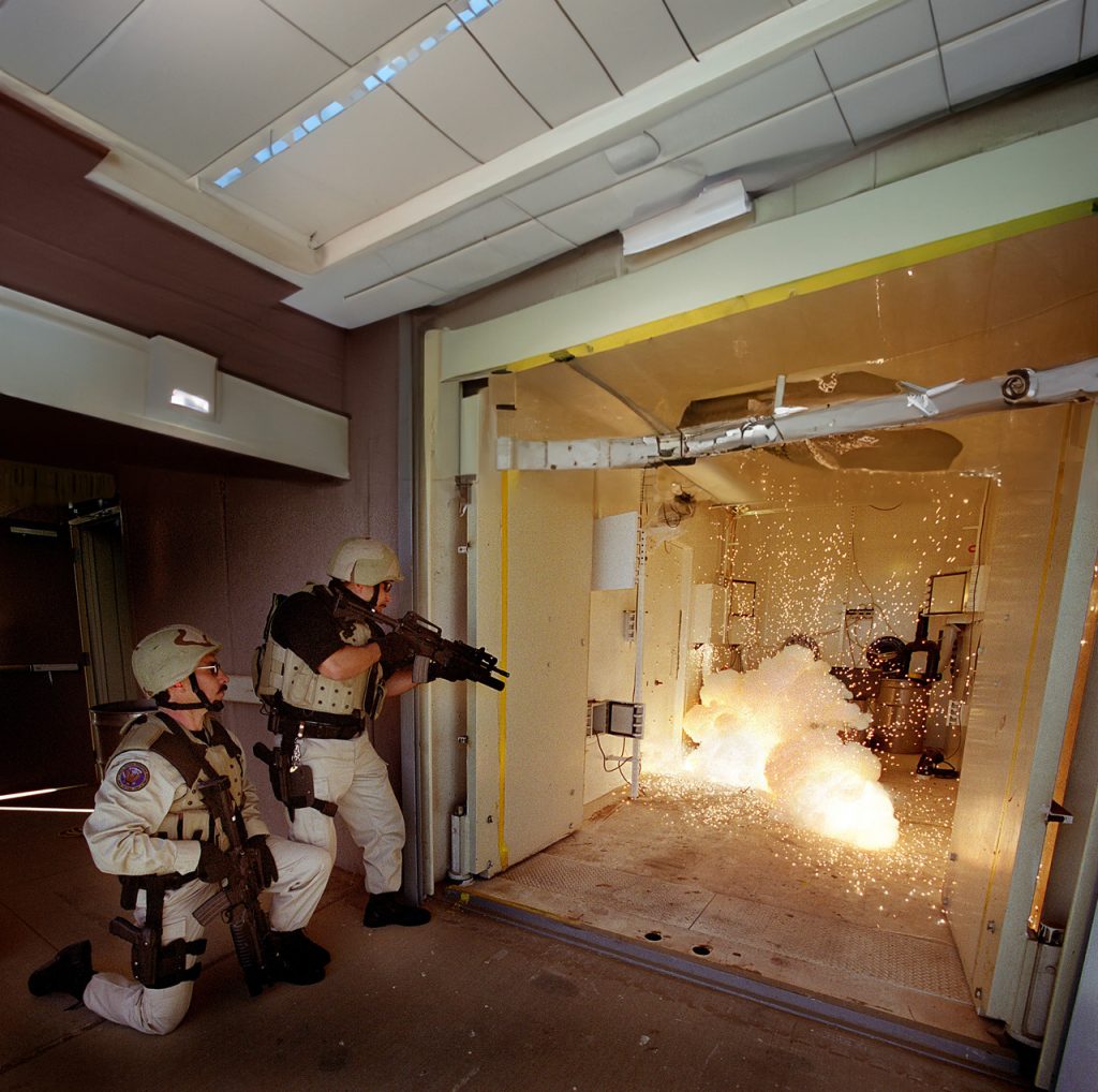 Two law enforcement officers testing deterrent technology.