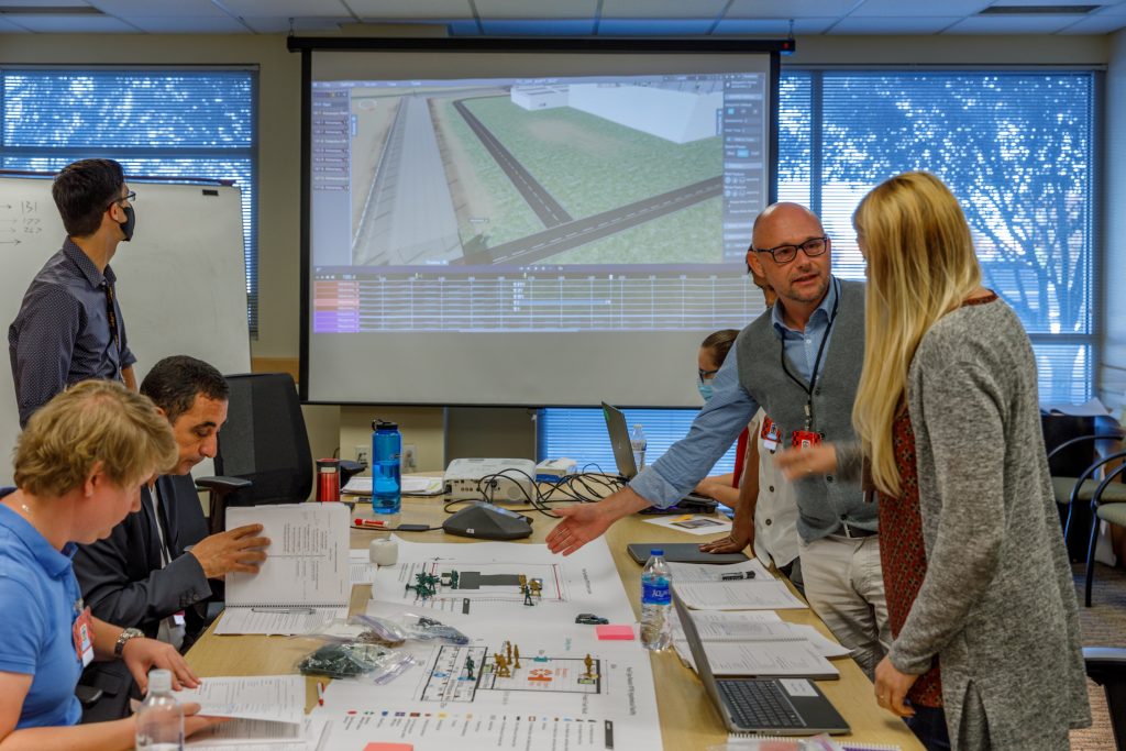 Experts participating in a tabletop exercise using Scribe3D software
