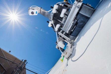 Sandia National Laboratories researchers use crawling robots and drones with infrared cameras to look for hidden wind blade damage to keep blades operational for longer and drive down the costs of wind energy. (Photo by Randy Montoya)