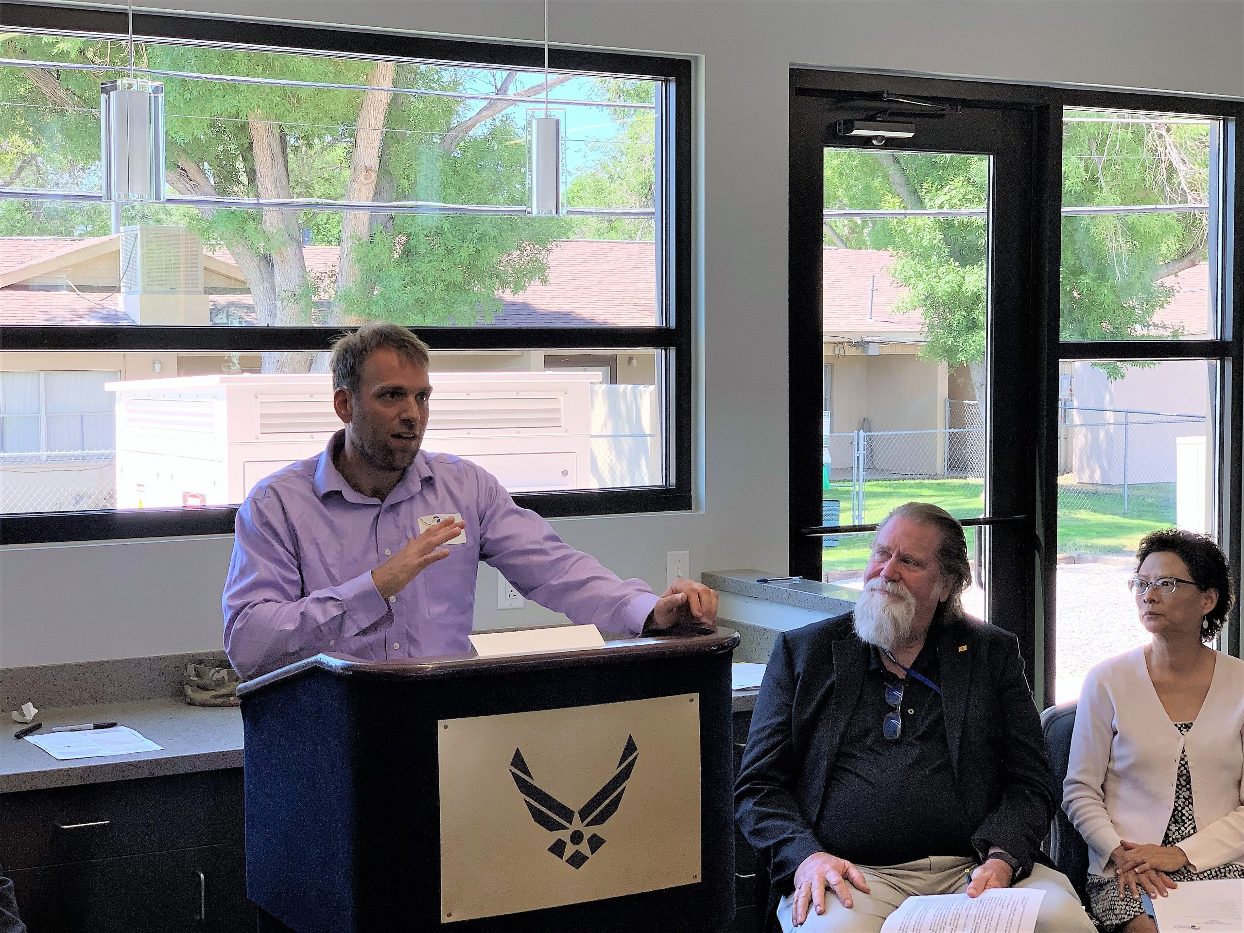 DC Microgrid PI Jack Flicker discusses Sandia and Emera’s project and advantages of creating self-sustaining microgrids during the ribbon cutting for Phase one of the project at the new KAFB community center near the Base’s temporary housing units. (Photo by Dan Ware)