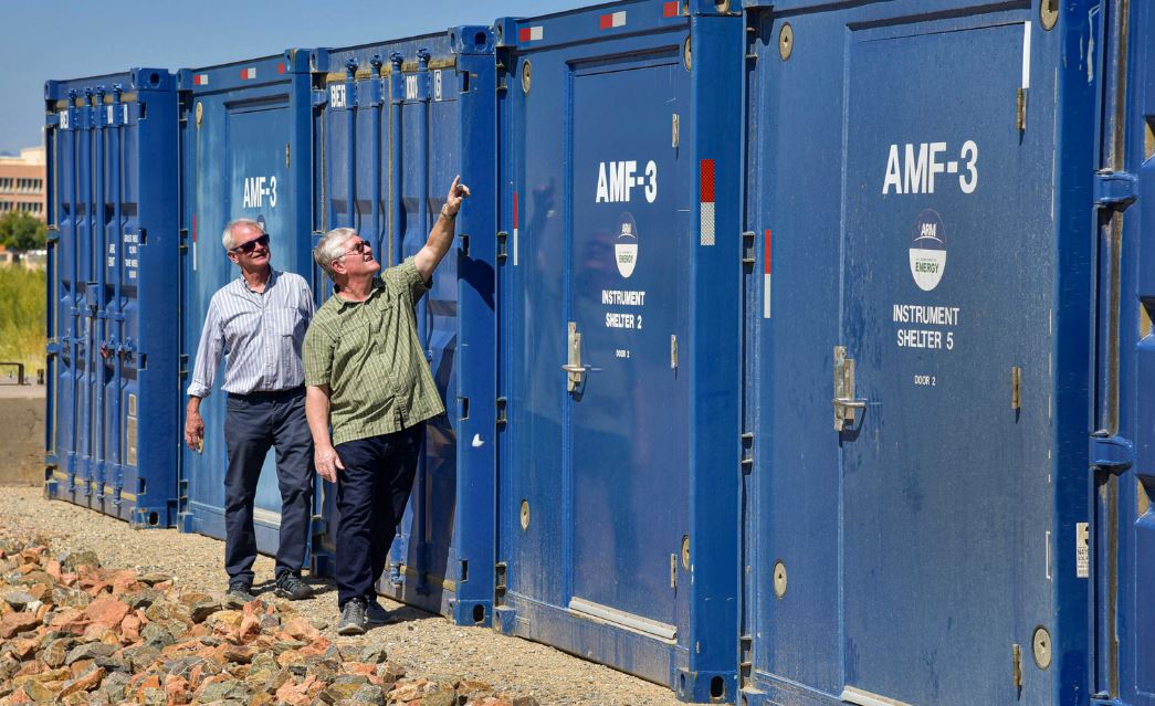 Mark Ivey, left, a Sandia National Laboratories senior engineer, and Fred Helsel, a systems engineer, inspect a shelter that had been stationed in Oliktok Point, Alaska. After eight great years of observations and research, a Sandia National Laboratories-operated Atmospheric Radiation Measurement mobile facility moved from Oliktok Point. (Photo by Randy Montoya) Click on the thumbnail for a high-resolution image.