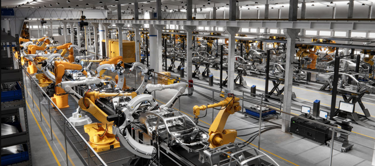 robotic arms assemble a product in a factory