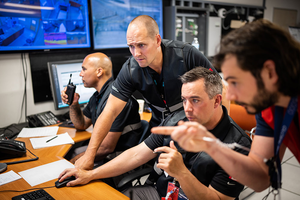 DUAL ATTACK — Sandia global security staff works with a team from a private Canadian nuclear power plant during a cyberattack exercise on May 17. The mock cyberattack was followed by a simulated physical intrusion. The exercise was the culmination of two-year project involving Sandia, Idaho National Laboratory and Canadian Nuclear Laboratories. (Photo by Craig Fritz)