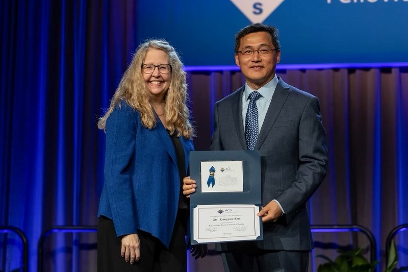 Sandia National Laboratories materials scientist and researcher Hongyou Fan has been named a fellow of the American Chemical Society. His work has applications in electronics, energy, materials separation and more. He received the ACS Fellow award, presented by Angela Wilson, immediate past president of American Chemical Society, on August 14. (Photo courtesy of EPNAC.com)