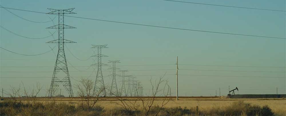 Powerlines against a dark blue sky