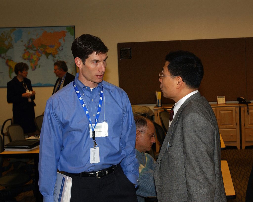 Sandia National Laboratories conference technical host Ren Salerno (left) discusses biosecurity issues with Won Keun Seong of the Republic of Korea’s Research Center for Pathogen Control.