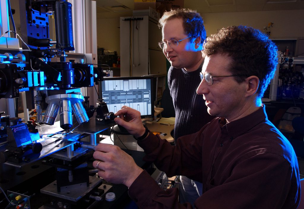 Maarten de Boer and Alex Corwin investigate friction at the microscale using a recently-developed nanotractor actuator fabricated using the Sandia Ultraplanar MicroMachine Technology (SUMMiT VTM) process.