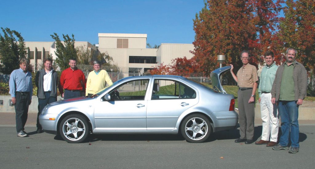 The research team with the Volkswagen Jetta test vehicle. From left: Will Bachalo and Greg Payne (Artium), Greg Smallwood (NRC), Pete Witze (Sandia’s CRF), Gary Hubbard (consultant), Brian Graskow (Chevron), and Mike Fidrich (Artium).