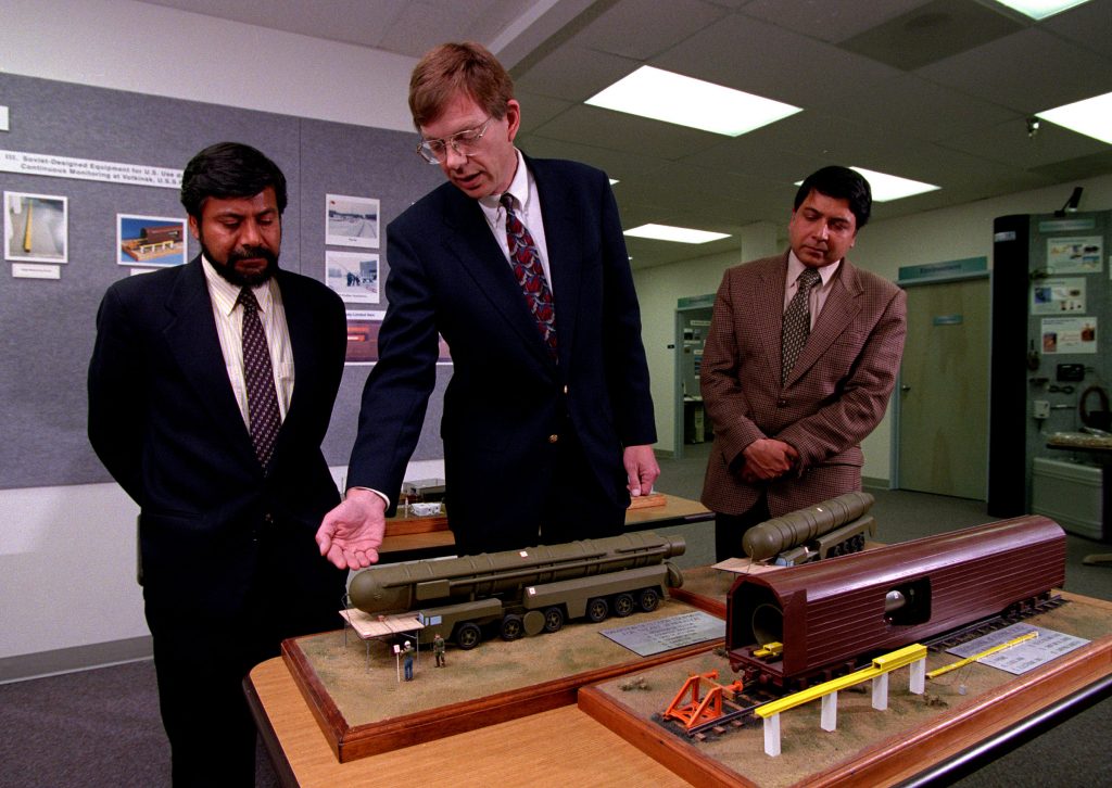 Kent Biringer (center) of Sandia’s Cooperative Monitoring Center (CMC) shows Nazir Kamal (left), an international relations expert from Pakistan, and Pravin Sawhney, a journalist and former major in the Indian army, a model of a nuclear missile in this 1998 photo taken at the CMC. Kamal and Sawhney were at Sandia as visiting scholars investigating missile transparency between their two countries as part of the CMC’s ongoing Visiting Scholars program.