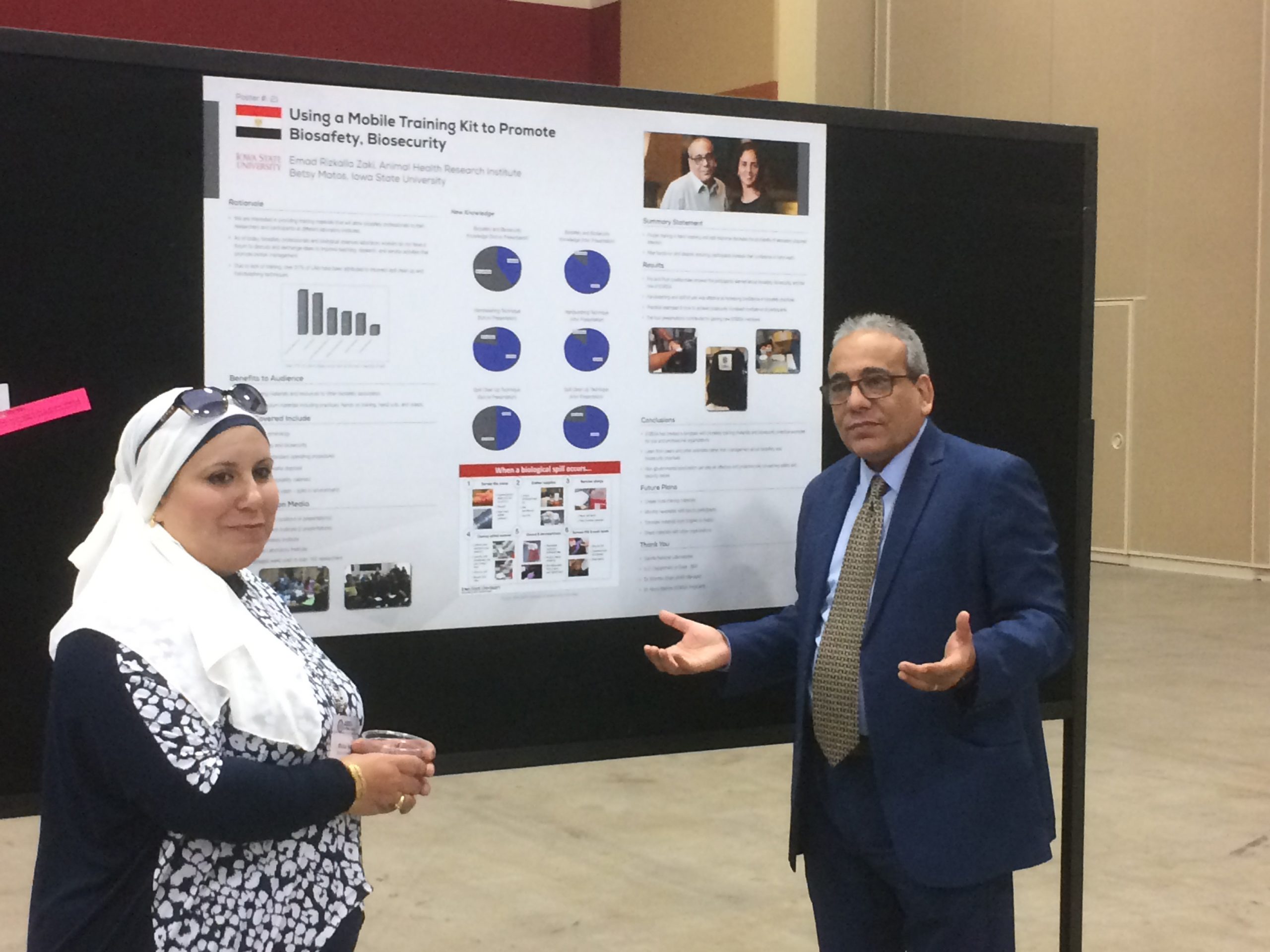 Emad Zaki pf Egypt explains his twinning project poster at the 2017 American Biological Safety Association conference.