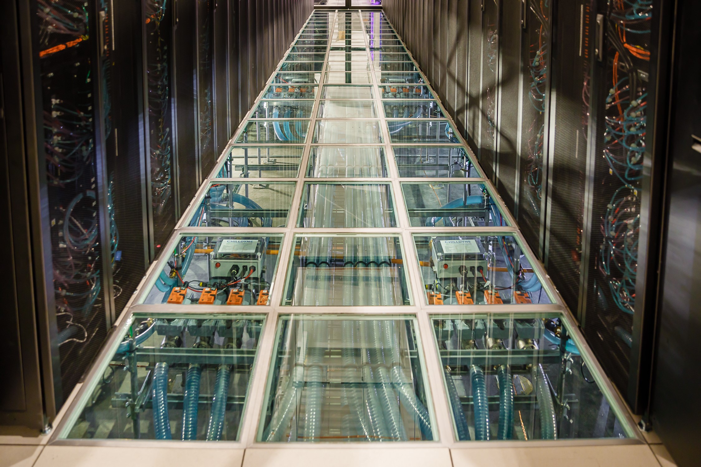 Water rushes through tubes and computer racks, providing a warm-water cooling system and keeping the high-performance computers from overheating at Sandia National Laboratories' newest data center.