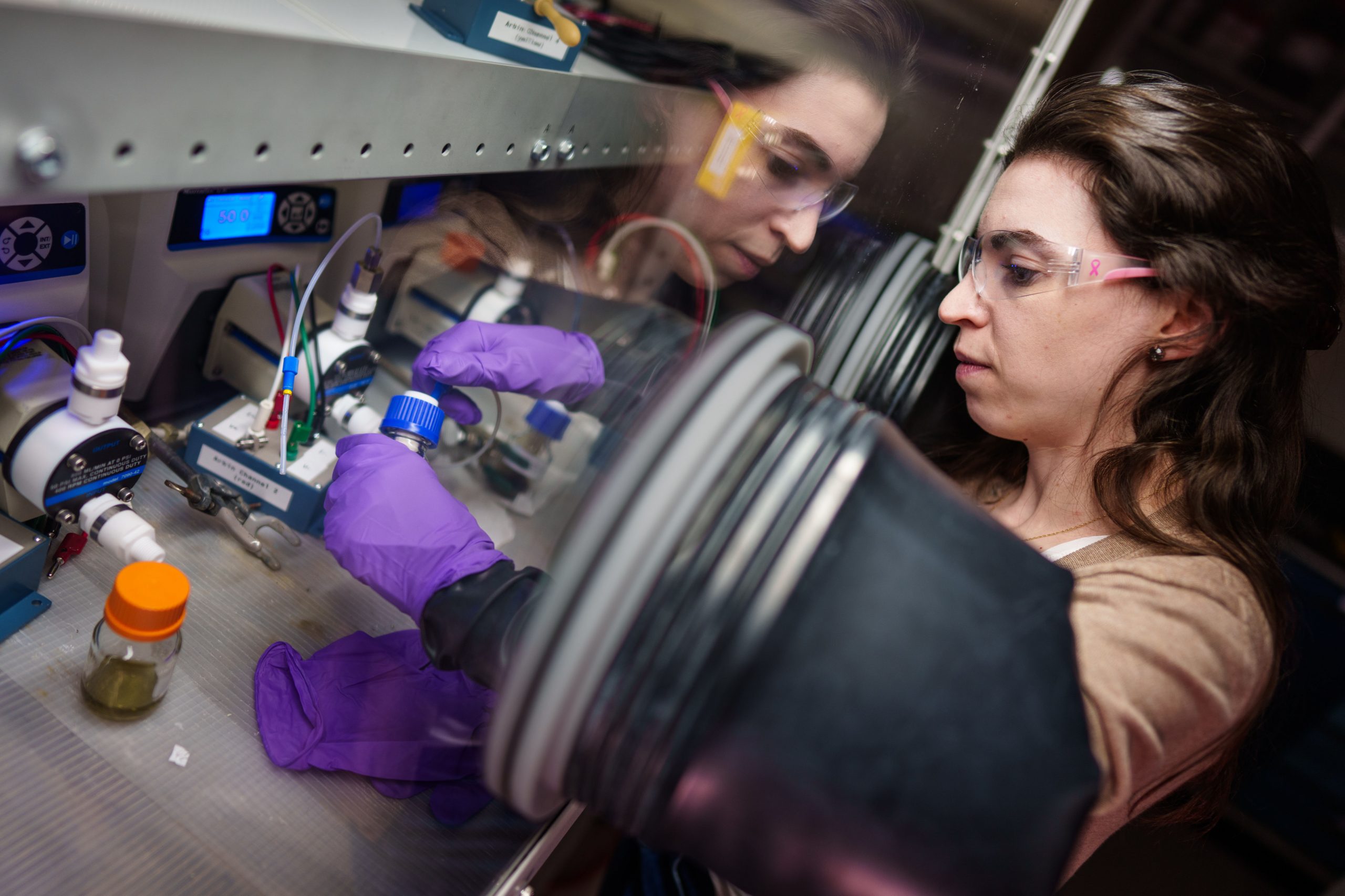 Sandia National Laboratories battery expert Melissa Meyerson works in a glovebox to setup a lithium-sulfur flow battery. These kinds of batteries have huge potential for being large, safe and in-expensive back-ups for a high-renewables grid.