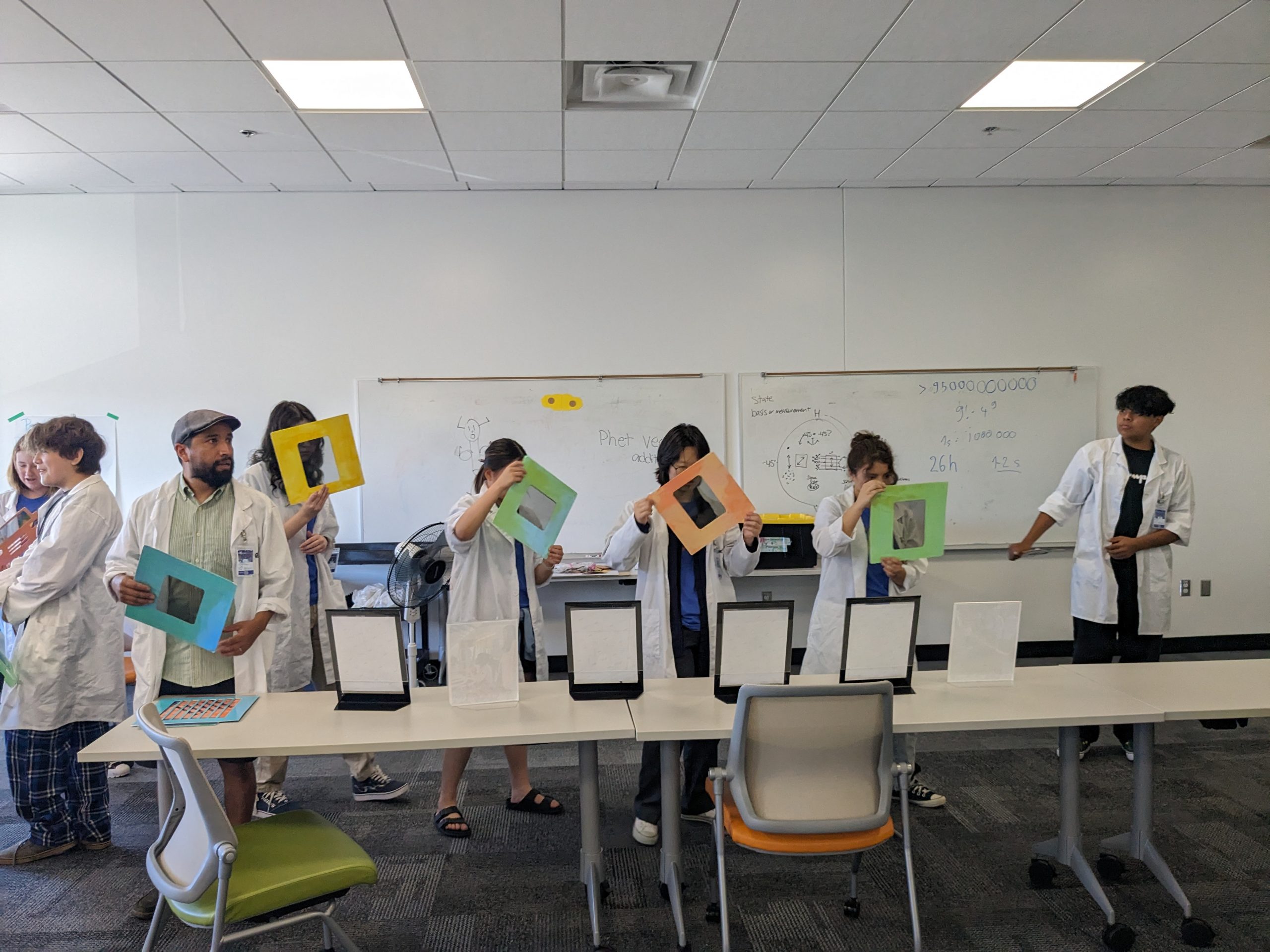 Students perform some hands-on activities with the SparCOS team during the 2023 QCaMP, organized by Sandia National Laboratories.