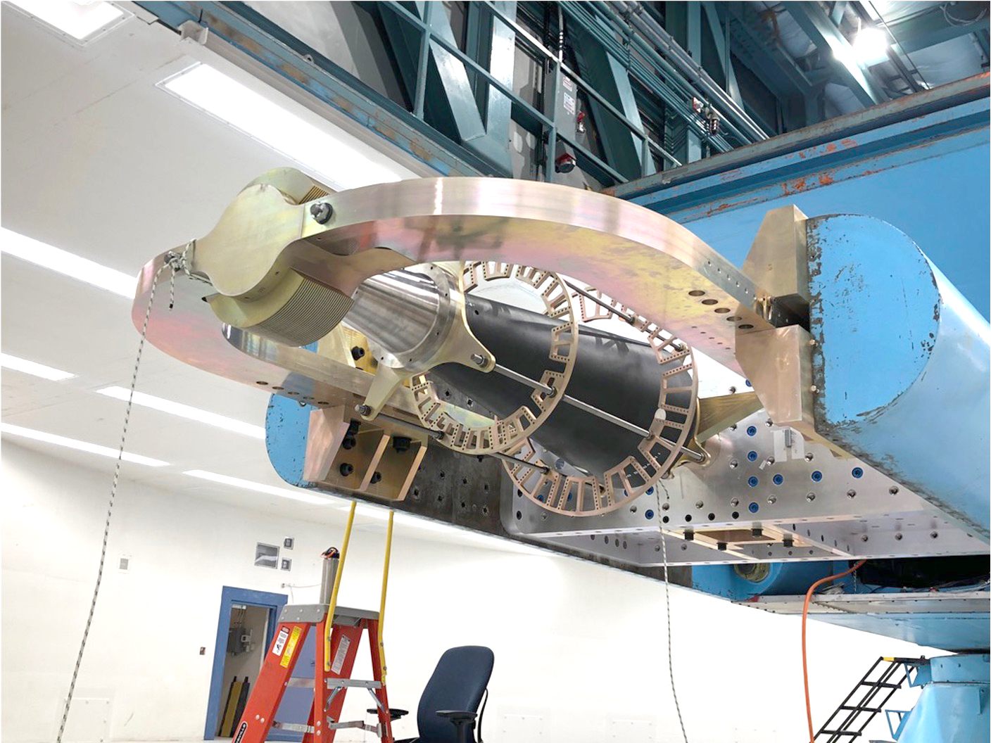 An experimental test system is mounted on the centrifuge arm prior to combined environments testing at the Sandia National Laboratories Superfuge/Centrifuge Complex in Albuquerque, New Mexico.