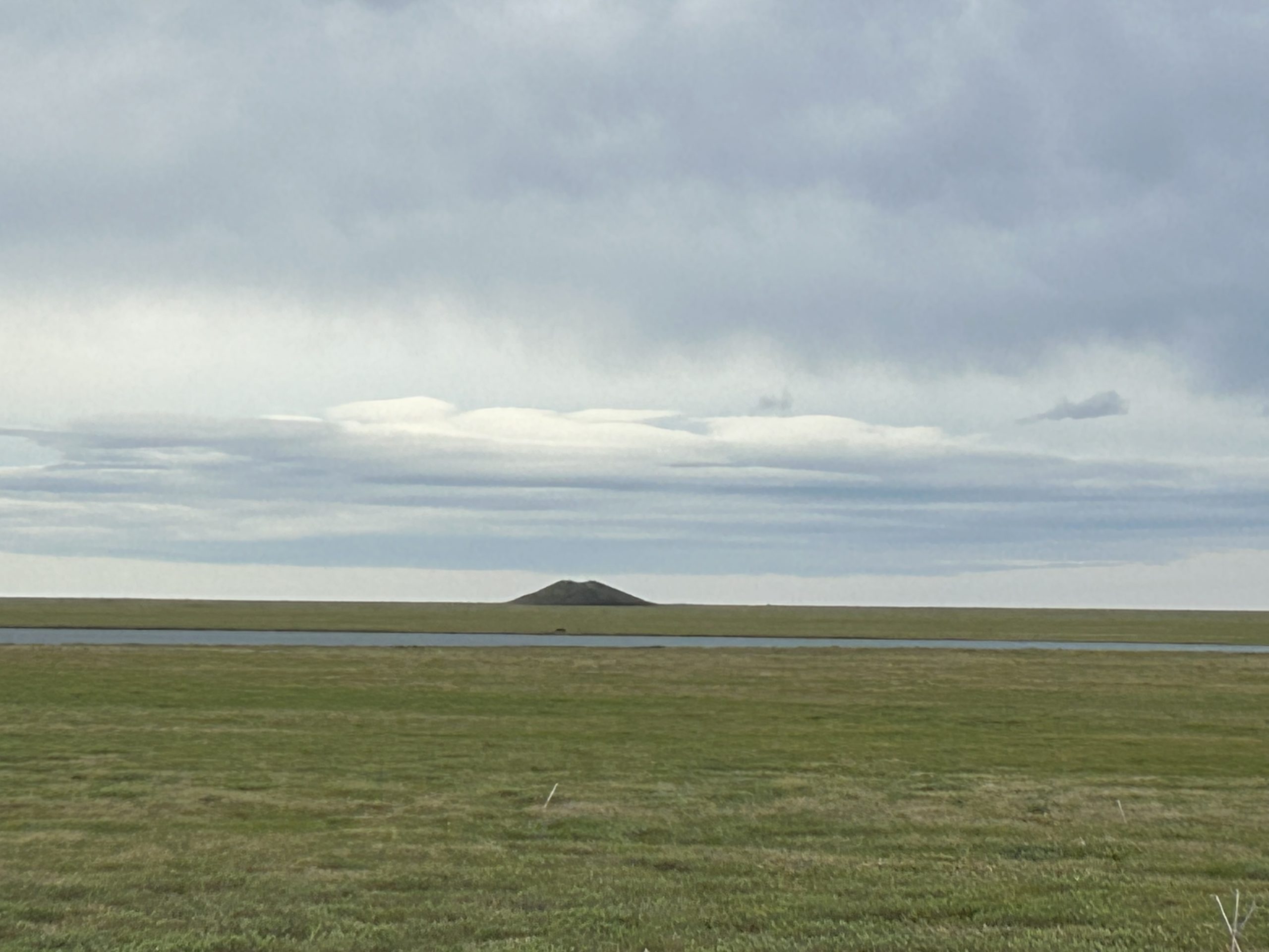 A permafrost-created pingo or “ice pimple” in the North Slope of Alaska. Scientists from Sandia National Laboratories have been using a fiber optic cable to study permafrost in the Arctic seafloor to improve the understanding of global climate change.