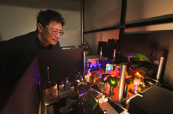 Sandia researcher Jeff Tsao examines the set-up used to test diode lasers as an alternative to LED lighting. Skeptics felt laser light would be too harsh to be acceptable. Research by Tsao and colleagues suggests the skeptics were wrong.