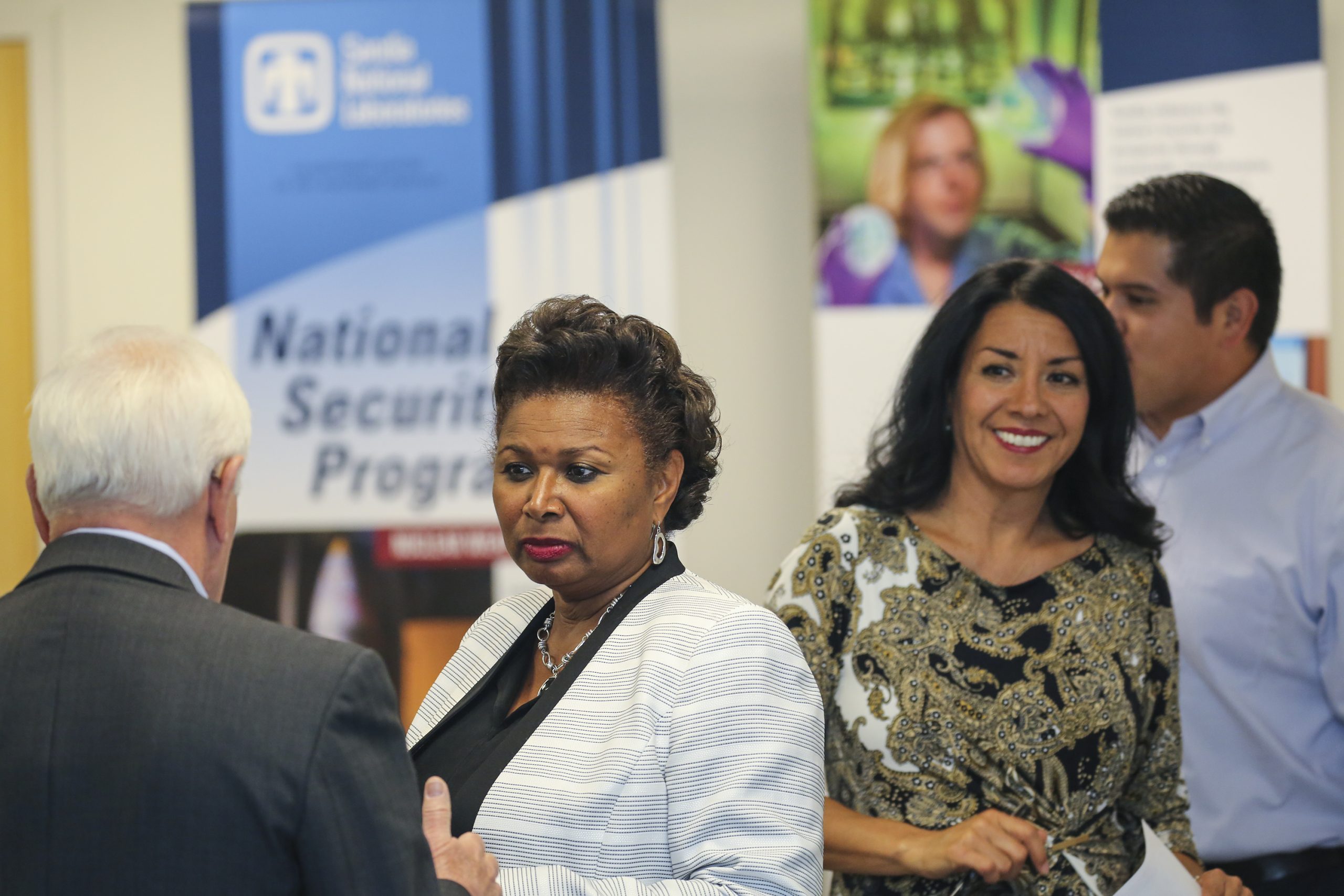 Sandia National Laboratories supplier diversity specialist Patricia Brown, right, and Theresa Carson, senior manager of Policy, Assurance and Outreach, greet business owners at a Sandia supplier open house. (Photo by Lonnie Anderson)