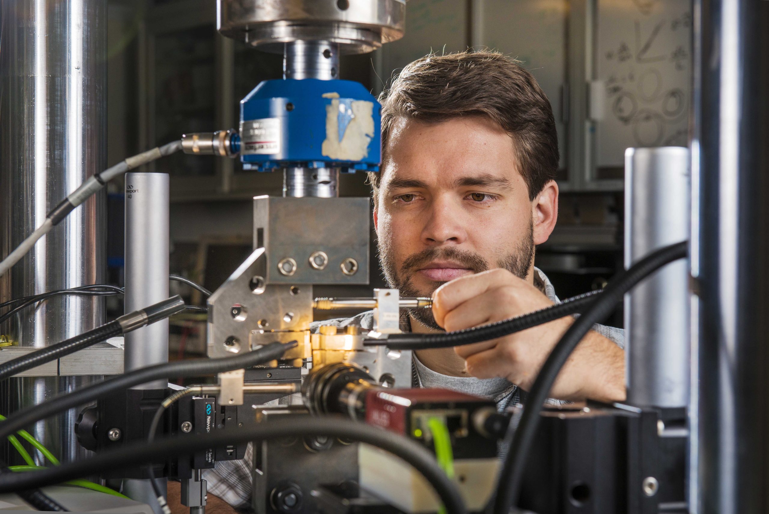 Sandia National Laboratories researcher Brad Salzbrenner tests laser-welded objects in pure tension, shear and mixed tension-shear loading. One pilot study in Sandia's long-term Predicting Performance Margins program involves laser welds, which are widely used in engineered systems.