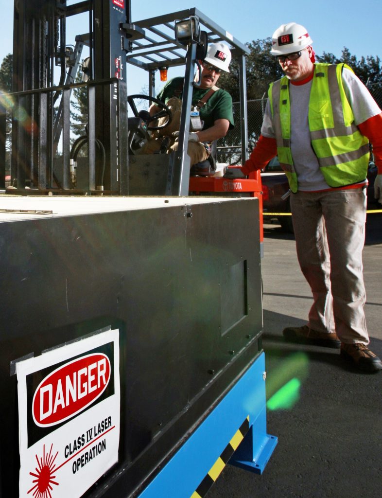 Contractors at Sandia/California prepare the LENS machine for its transfer to nearby Las Positas College. The school’s welding department plans on using the historic piece of equipment to introduce students to metal joining techniques. Click on the thumbnail for a high-resolution image. (Photo by Randy Wong)