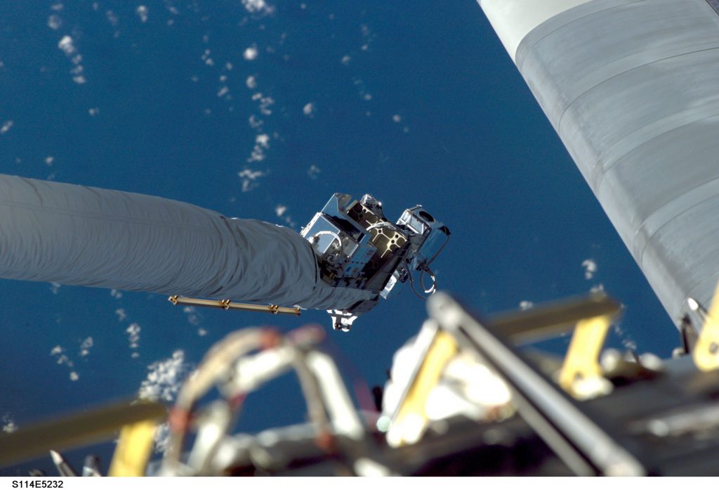 Sandia’s orbiter inspection sensor, attached to the space shuttle Discovery’s robotic arm, characterized loose gap fillers.