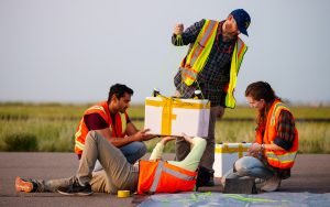 From left to right, Sandia National Laboratories electrical engineer Prabodh Jhaveri, intern Will Barrett, technologist Michael Fleigle and intern Summer Czarnowski prepare a payload for a weather balloon launch. (Photo by Craig Fritz) Click on the thumbnail for a high-resolution image.