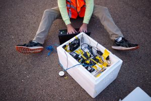 Sandia National Laboratories intern Will Barrett prepares the payload for launch. The payload records GPS and non-GPS signals. After the flight, researchers compare their calculations from non-GPS signals to the actual positions. (Photo by Craig Fritz) Click on the thumbnail for a high-resolution image.