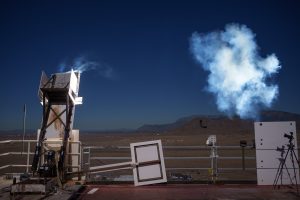 A cloud of smoke coming off of a glowing rectangle.