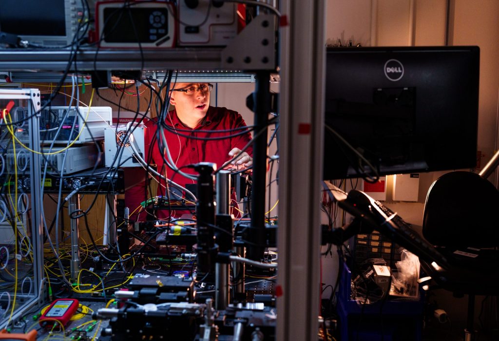 Sandia National Laboratories physicist Nils Otterstrom works to align an integrated photonics chip at the quantum photonics lab. It’s part of ongoing work with Arizona State University to combine the power of integrated photonics and frequency-bin quantum information processing. Recently, Sandia awarded $17 million in Laboratory Directed Research and Development funds to take this work to the next level. (Photo by Craig Fritz) Click on the thumbnail for a high-resolution image.