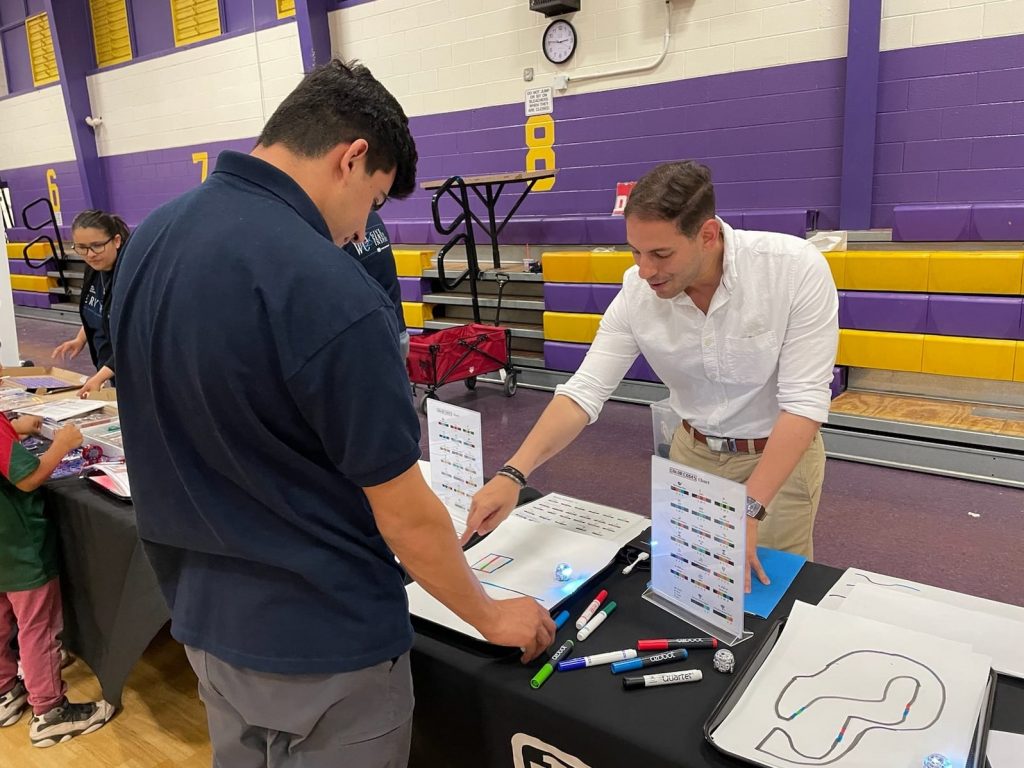 Sandia National Laboratories electrical engineer Rachid Darbali-Zamora volunteers at Garfield Middle school in Albuquerque New Mexico as part of Hispanic Outreach for Leadership Awareness’s Noche de Ciencias. (Photo courtesy of Sandia National Laboratories) Click on the thumbnail for a high-resolution image.