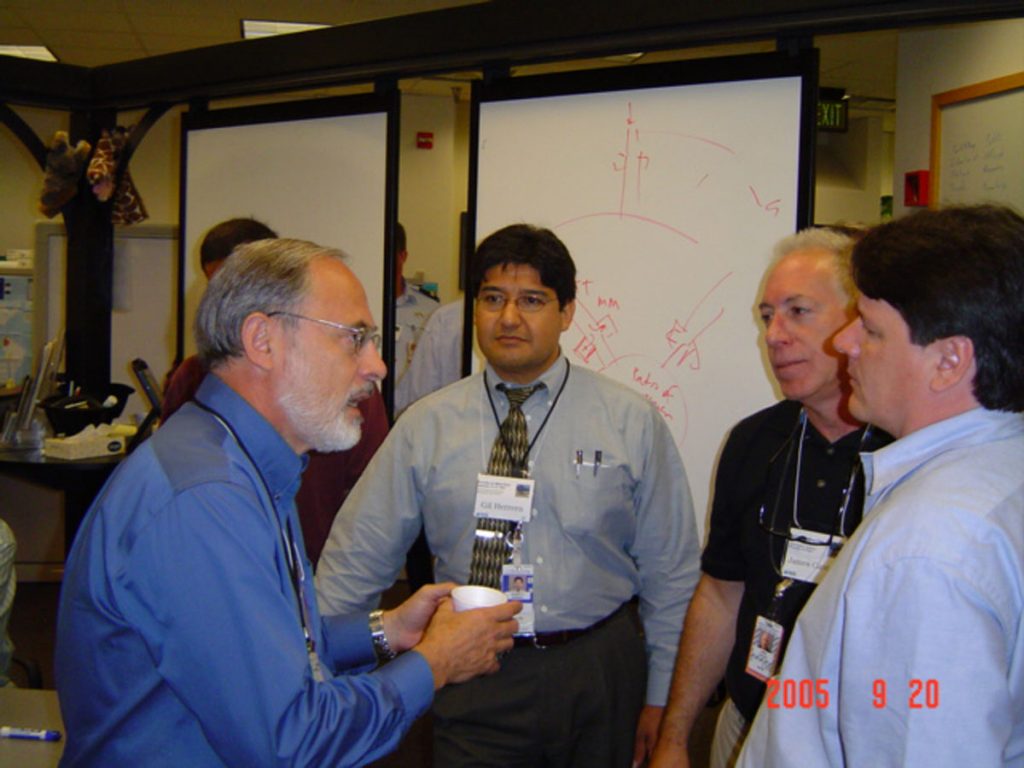 ACG leader and Sandia VP and principal scientist Gerry Yonas (left) discusses ideas with participants.