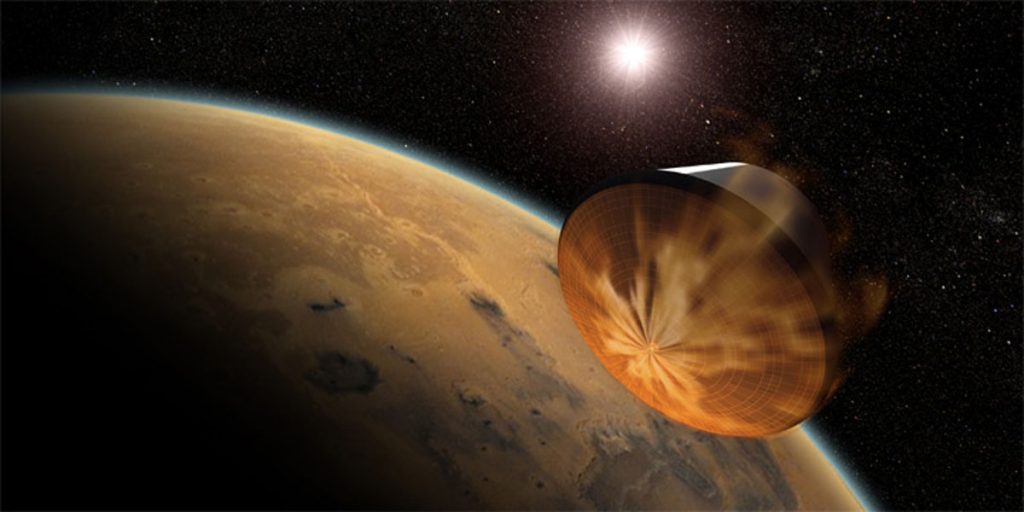 Artist concept of a spacecraft using aerocapture to enter an orbit around Mars.