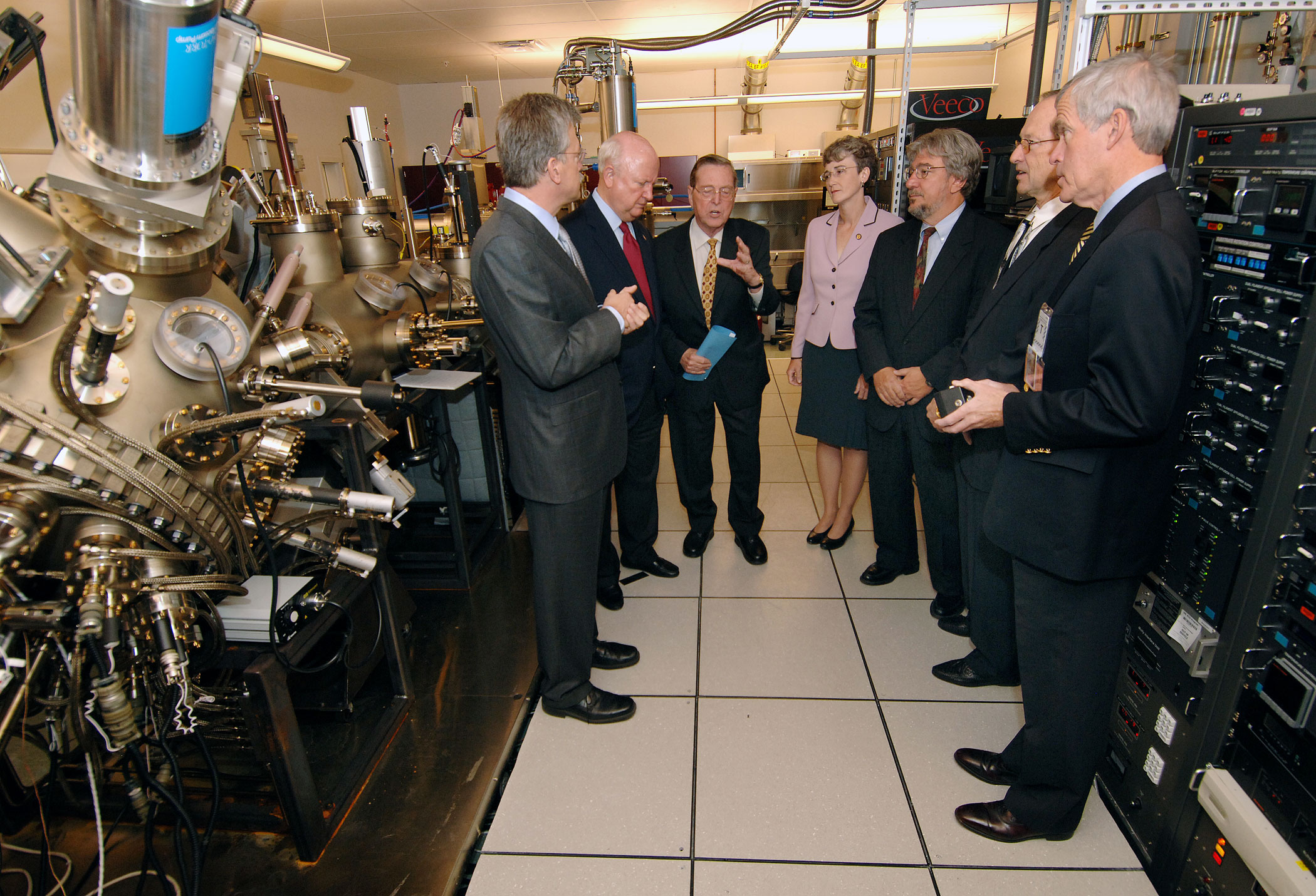 From the left, Jerry Simmons, senior manager of Sandia’s Energy Sciences Department, briefs U.S. Department of Energy Secretary Samuel Bodman, Sen. Pete Domenici, R-N.M., Rep. Heather Wilson, R-N.M., Los Alamos National Laboratory Director Michael Anastasio, Sandia President and Laboratories Director Tom Hunter, and Sen. Jeff Bingaman, D-N.M, at the Center for Integrated Nanotechnologies. Shortly after, Bodman announced that Sandia is the new home of the National Laboratory Center for Solid-State Lighting Research and Development.