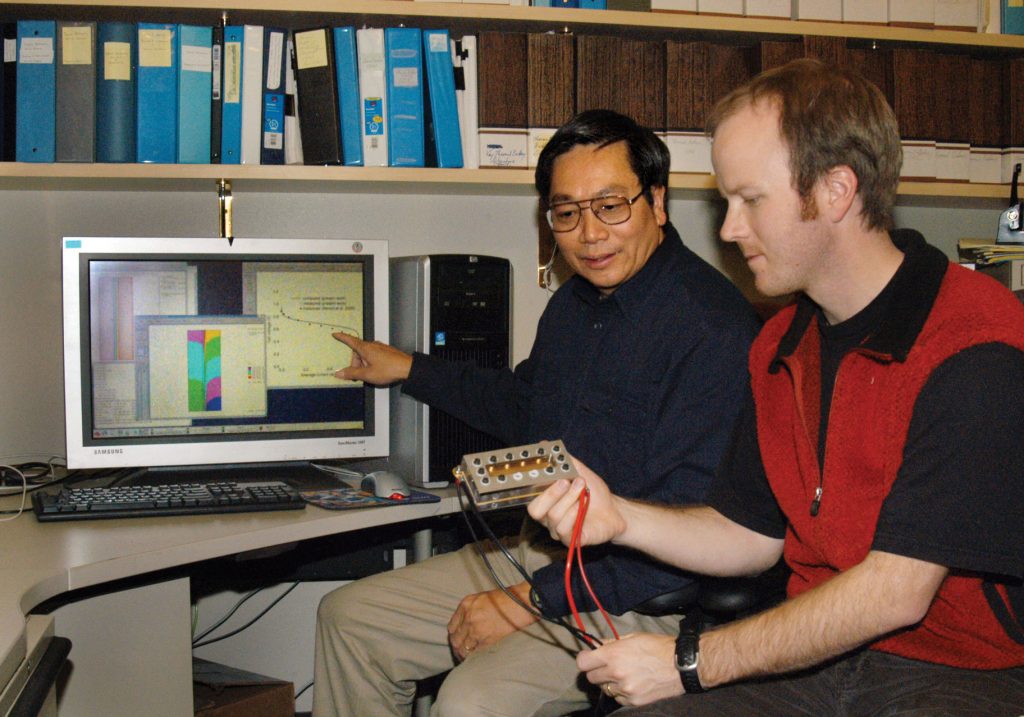 COLLABORATION — Sandia researchers Ken S. Chen, left, and Mike Hickner are collaborating on their research to study PEM fuel cells. Ken is developing computational models to describe the phenomena while Mike is performing physical experimentation. 