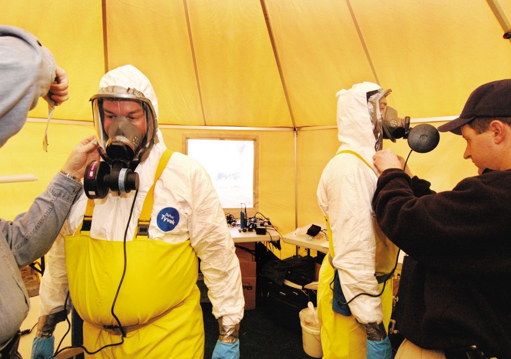 An exercise, in conjunction with the National Institute for Occupational Safety and Health (NIOSH) to test BROOM was held recently at Sandia. Here, NIOSH crews get suited in full HazMat gear before entering the simulated area.