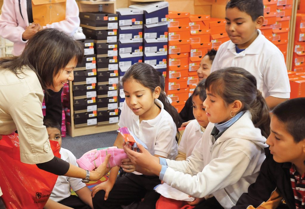 Three local elementary school students get new shoes during a recent Shoes for Kids fitting at Mervyn’s. (Photo by Randy Montoya)Download 300dpi JPEG image, ‘shoes2004.jpg’, 1MB (Media are welcome to download/publish this image with related news stories.)