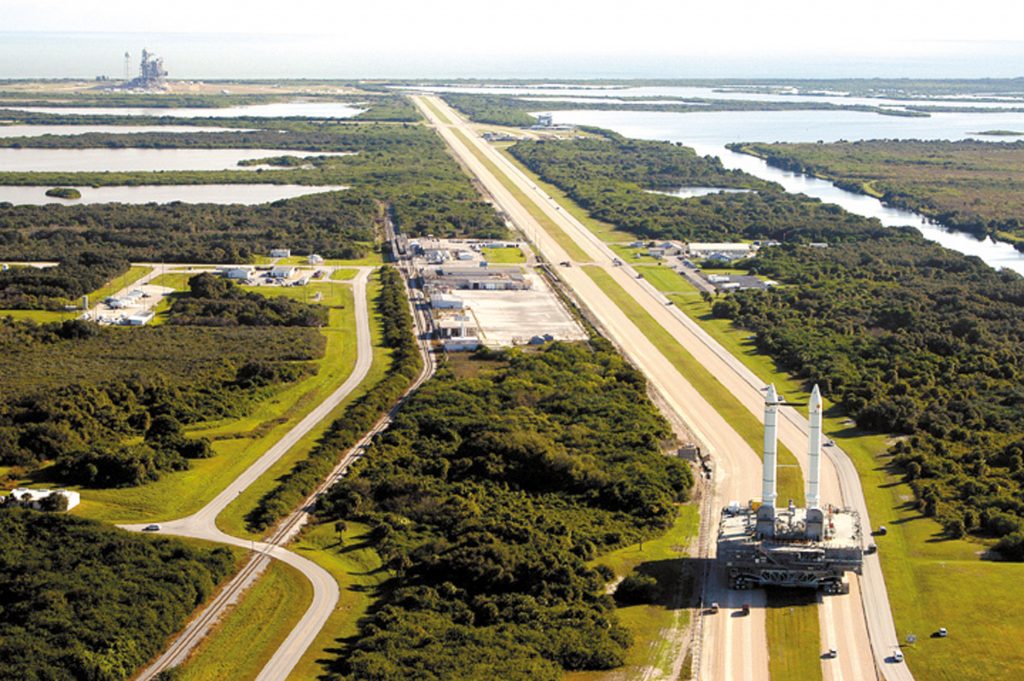 The mobile launch platform and the crawler make its way to the launch pad.