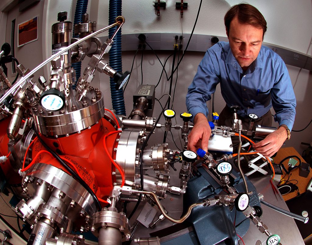 Arranging picopuffs Sandia National Laboratories researcher Steve Thornberg arranges picopuffs of gases from crushed MEMS devices to be sampled by his group’s unique analytic device.