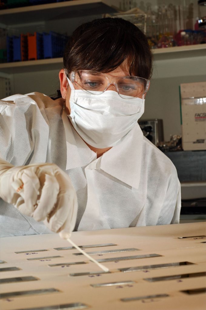 Mollye Wilson demonstrates sample collection techniques.