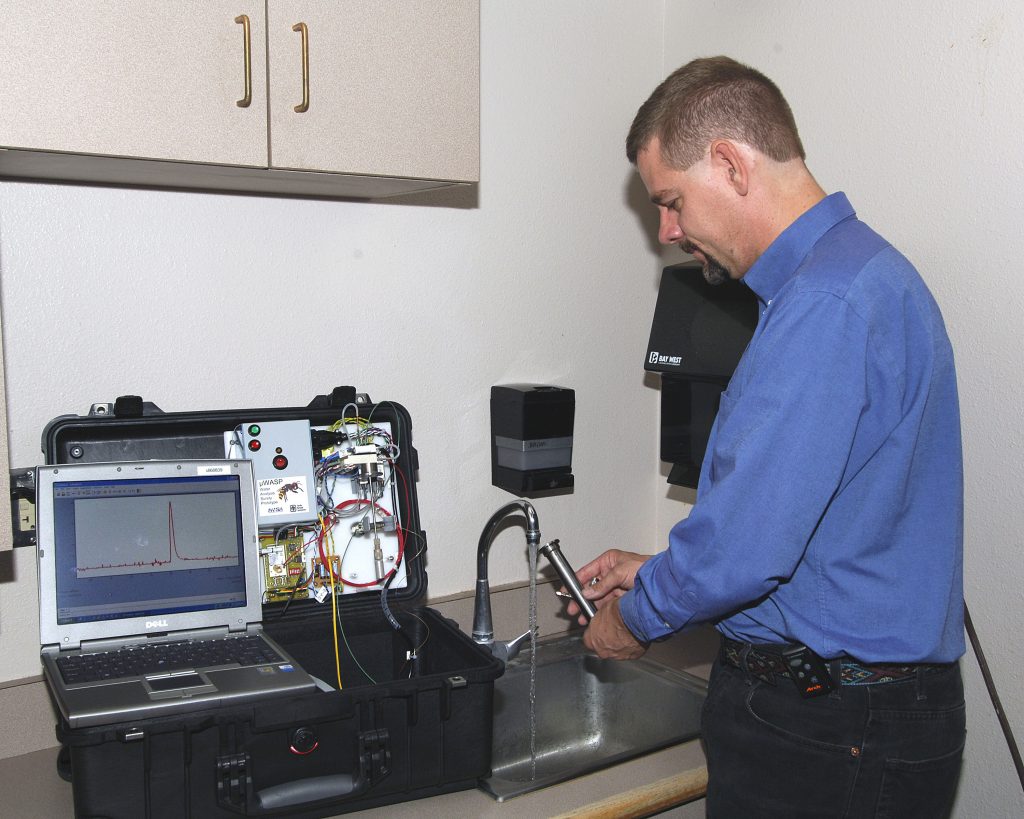 Curt Mowrey tests typical Sandia tap water for trihalomethanes.