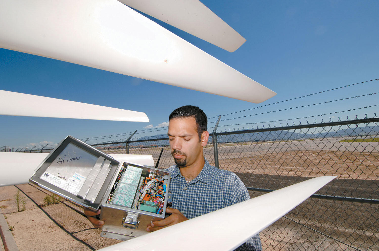 ATLAS II PROJECT LEAD Jose Zayas stands next to advanced blades that will be tested at Bushland, Texas.