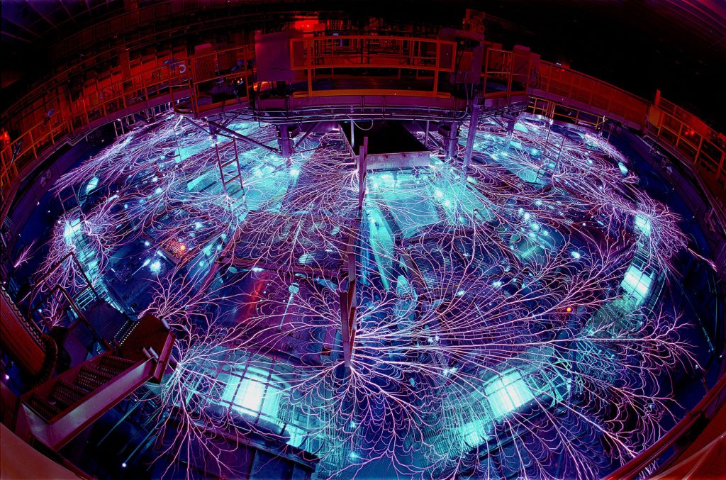 Sandia's Z machine firing. The “arcs and sparks” formed at the water-air interface travel between metal conductors.