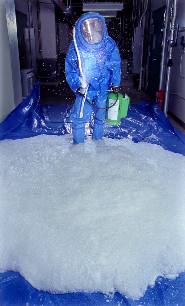 FOAM CO-DEVELOPER MAHER TADROS demonstrates application of the new chem-bio decontamination foam from a pressurized canister. The foam could be sprayed from handheld canisters or from trucks, or it could be incorporated into the fire sprinkler systems of high-profile government or military buildings.Download 300dpi JPEG image, 'FoamSpray.jpg', 1.9M