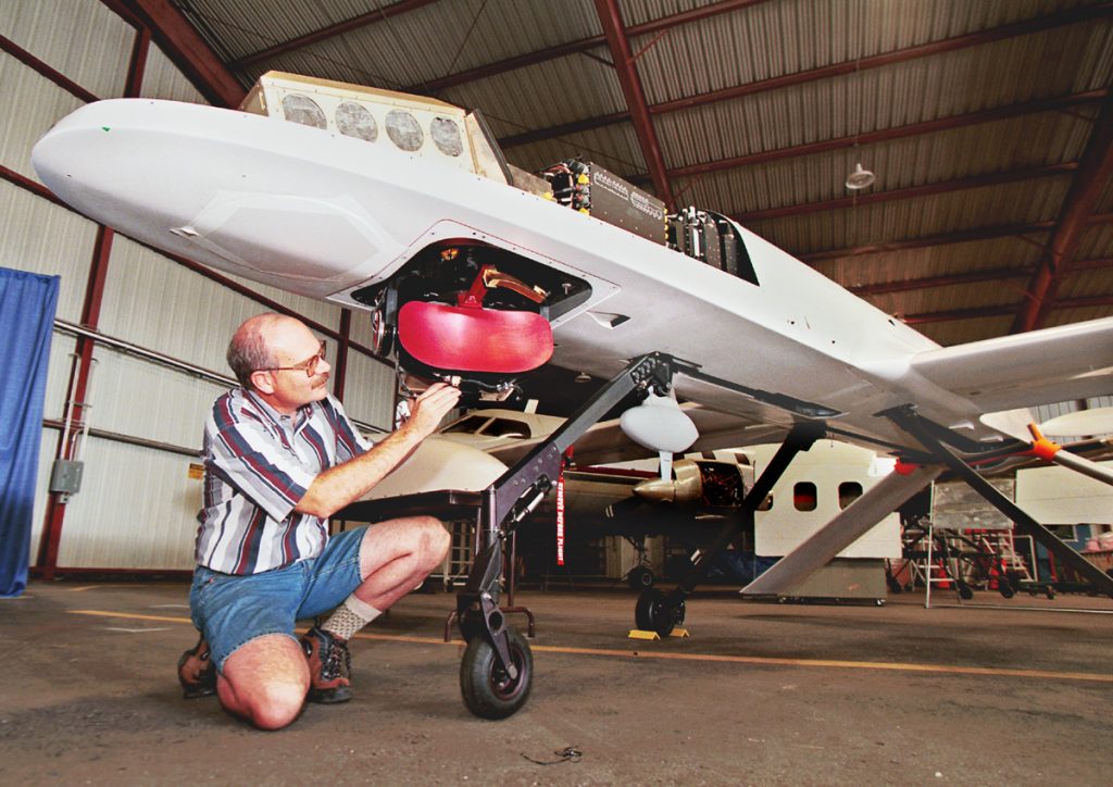 Sandia researcher Bill Hensley checks the Lynx synthetic-aperture radar (SAR) installed on a General Atomics I-GNAT unmanned aerial vehicle.