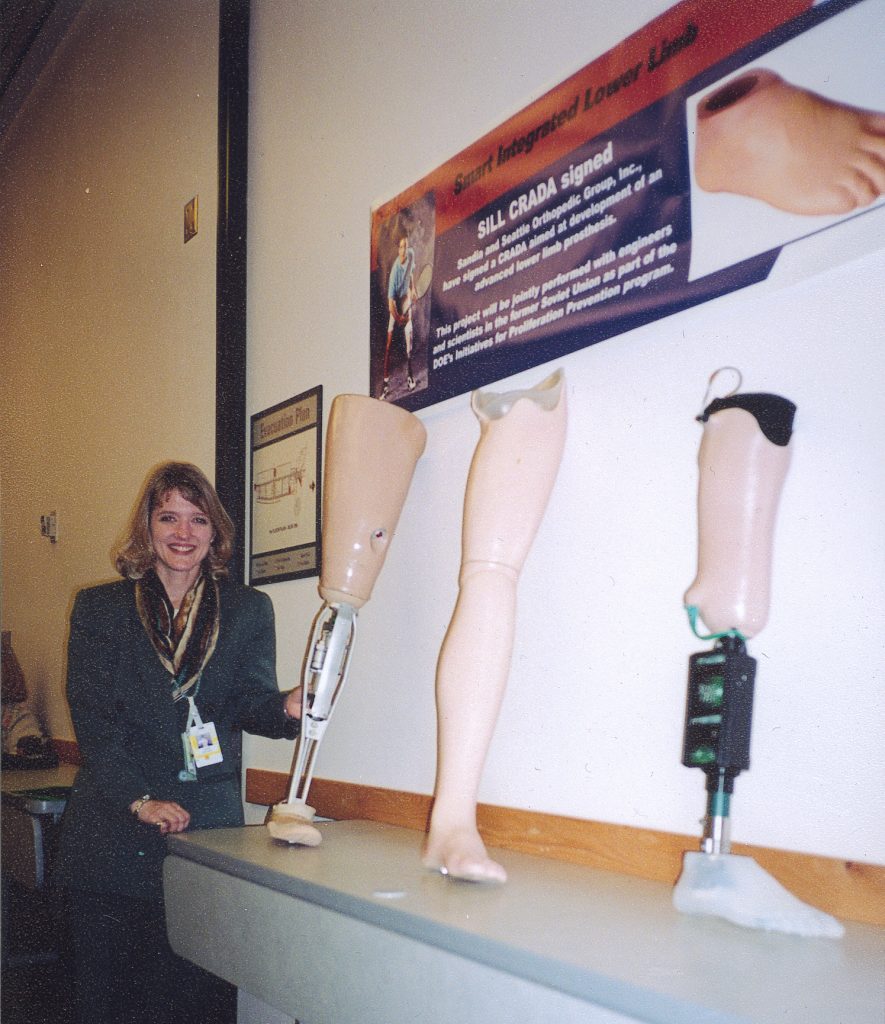 Sandia researcher Diane Hurtado inspects older prosthetic devices lent by SOGI to Sandia. The synthetic lower limbs are expected to help researchers generate ideas for the next generation of prosthetics.