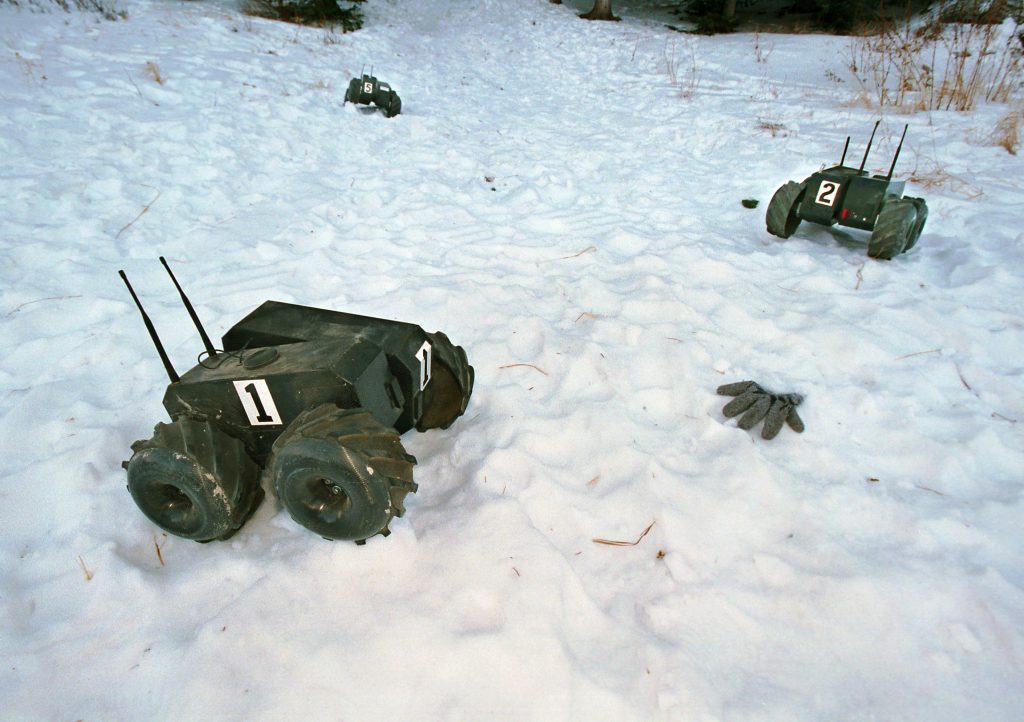 MICHAEL JACKSON, ARE YOU OK? -- A team of robots from Sandia National Laboratories demonstrate how their computer program would help rescuers quickly locate a skier buried under an avalanche. The photo is staged.