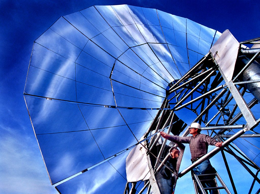 DISHING IT UP -- Sandia National Laboratories researcher Rich Diver checks out the first prototype of the 10-kW Solar Dish/Stirling Remote Power System, which incorporates the best of advanced solar technology developed at Sandia in recent years. A version of the solar collector will be placed on Indian Lands in the Southwest where it will pump water for agricultural purposes.