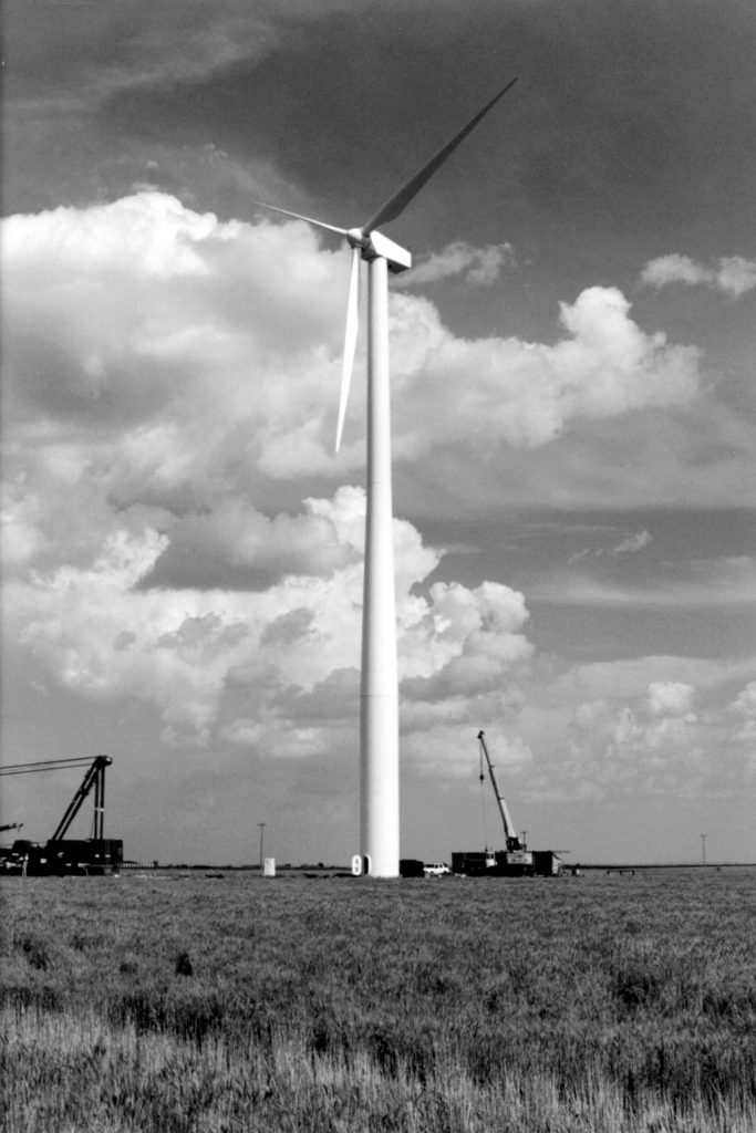 Three 80-feet-long blades turn the wind turbine generator at Llano Estacado Wind Ranch, near Clovis, N.M. The turbine sits atop a 230-feet-tall tubular steel tower. The generator can produce 660 kilowatts from winds blowing between eight and 55 miles per hour.