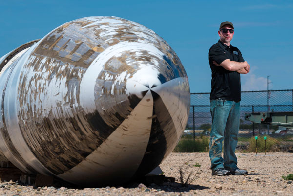 Ryan Kristensen stands next to a Polaris missile