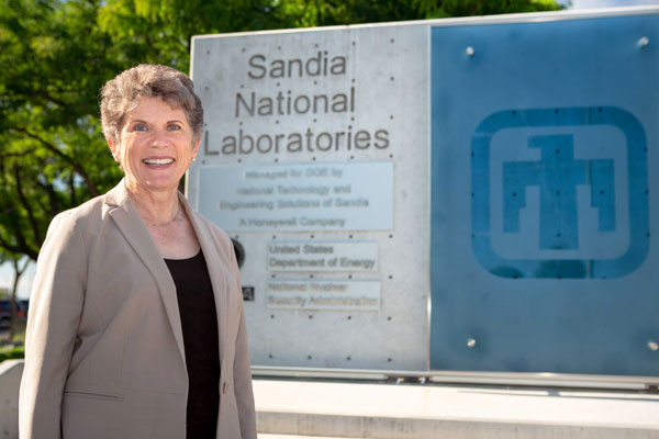 Dori in front of the Sandia sign at the Albuquerque campus